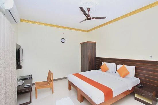 AC room with orange pillows
