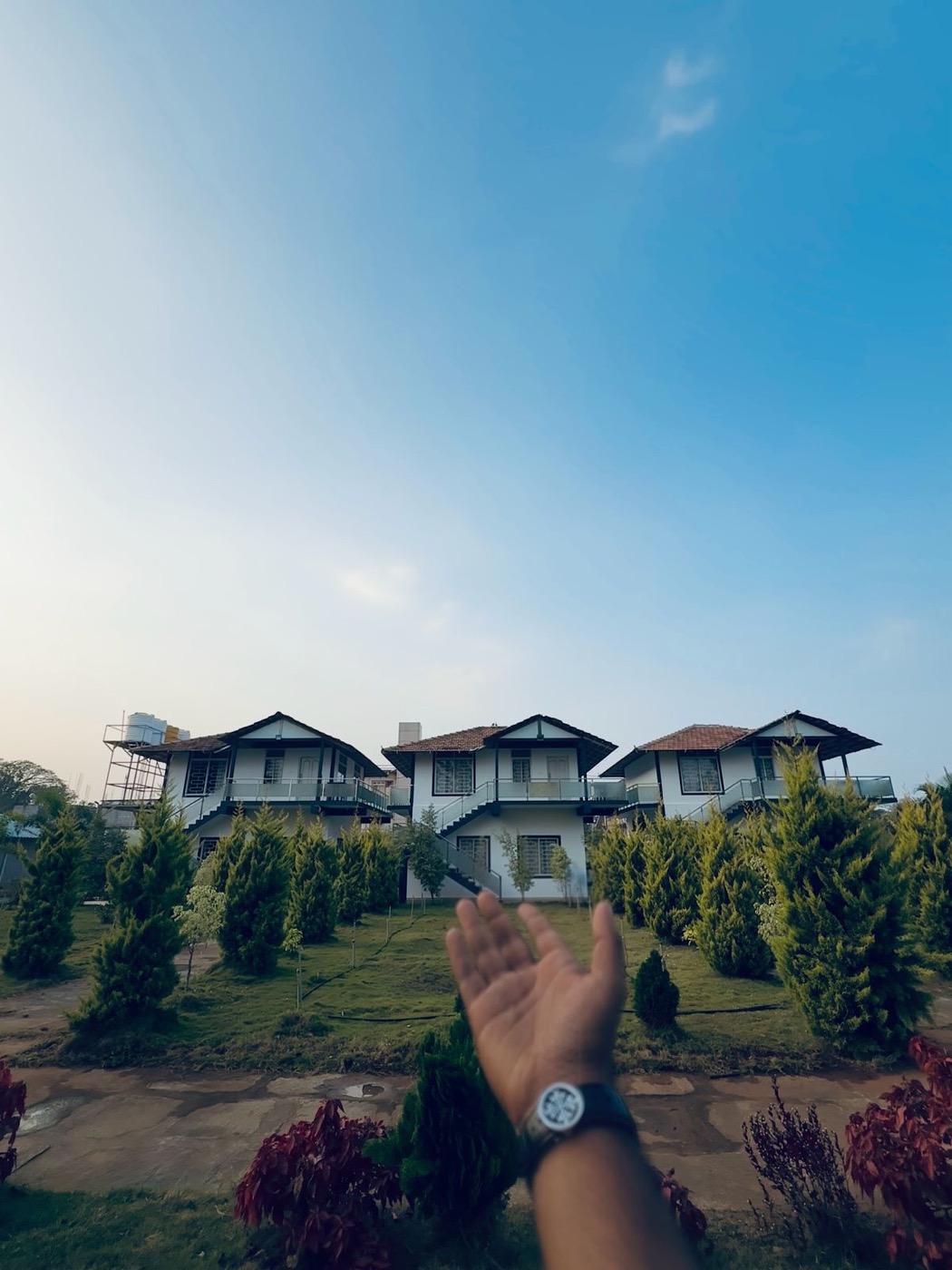 Coorg Homestay cottages under blue sky