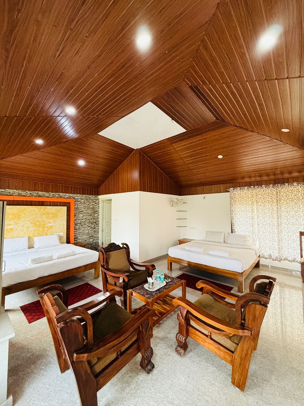 Family room with wooden ceiling and seating