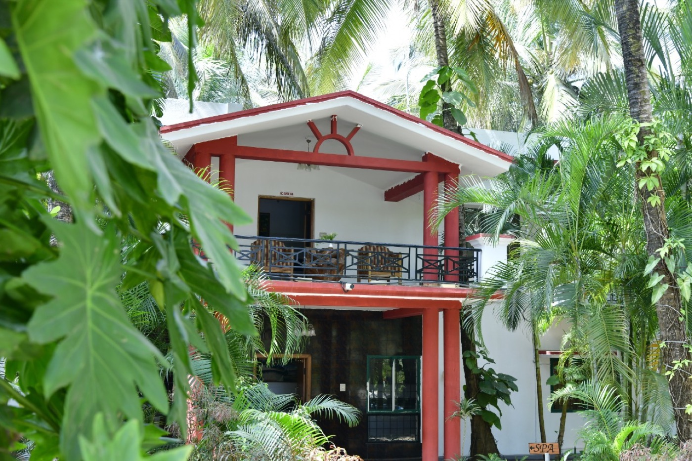 Coorg Homestay building among tropical greenery